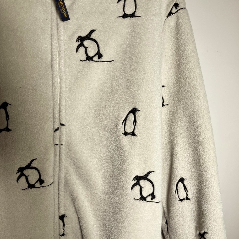 Womens white fleece jacket with little penguins on it.